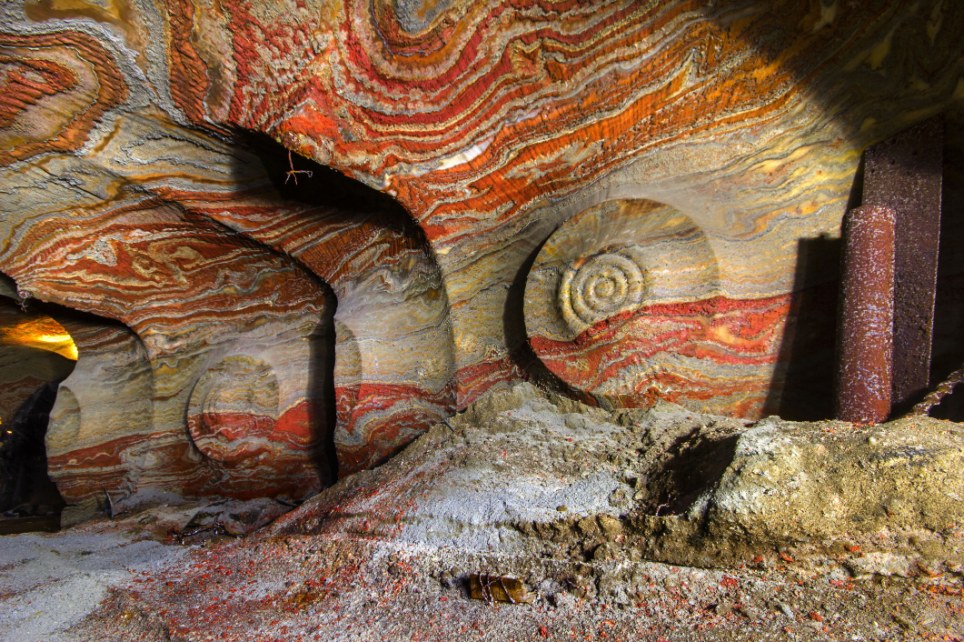 Naturally unnatural: The minerals give the walls blight colours and 'psychedelic' patterns in yellow, red, blue and green